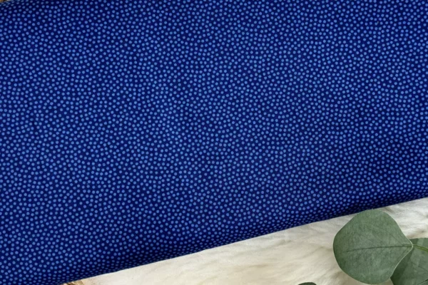 Baumwollstoff mit bunten, unregelmäßigen Punkten in blau